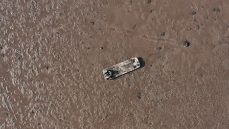 Barge-for-shellfish-farming-tide-out-moored-in-mud-from-above
