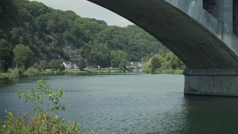 View-through-railway-bridge-Pont-du-Chemin-de-Fer-at-the-landscape-of-the-Ardennes,-Huy,-Hoei,-Belgium,-Europe,-4K,-25fps