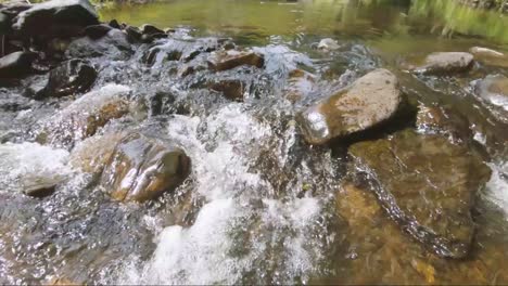 Slowmotion-view-of-water-and-stones-in-the-Ardennes,-Belgium,-Europe,-filmed-in-2