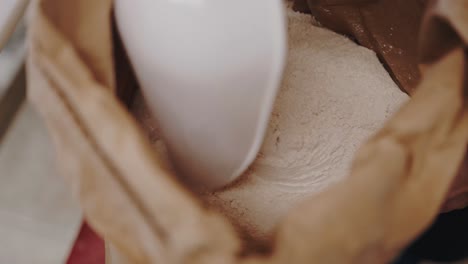 Close-uo-Shot-of-a-baker-mixing-flour-in-a-sack
