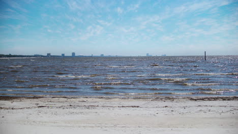 The-Beach-in-Gulfport,-Mississippi-overlooking-Biloxi-on-a-beautiful-sunny-day