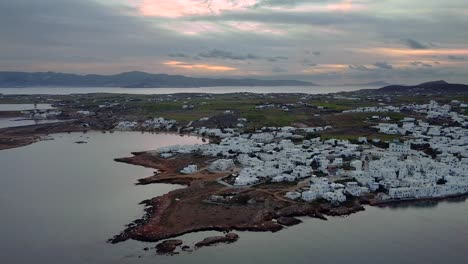 Wide-drone-shot-of-Naoussa,-Paros,-Greece-during-sunrise