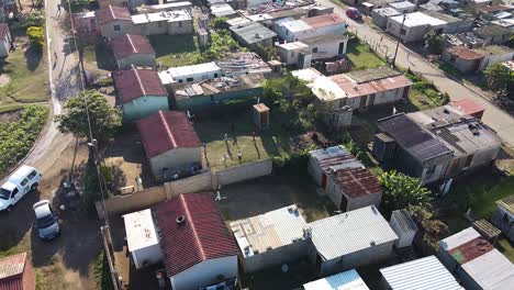 A-drone-shot-of-a-Zulu-village-while-kids-play-soccer