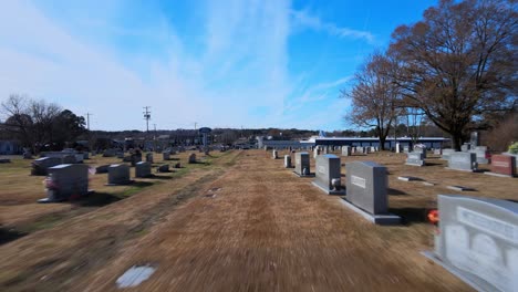 Quick-flythrough-in-cemetery,-flying-past-headstones
