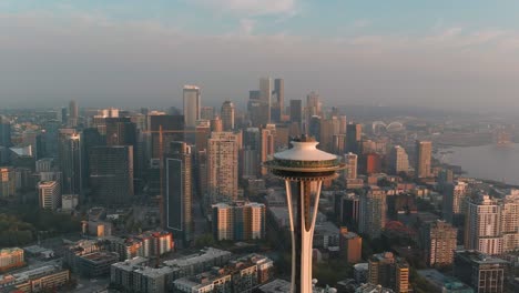 Orbiting-drone-shot-of-Space-Needle-during-a-golden-sunset