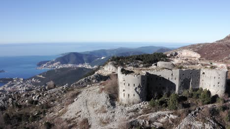 AERIAL---Fort-Kosmac-and-the-Adriatic-Sea,-Montenegro,-pan-left