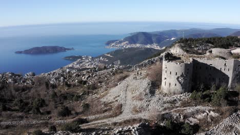 AERIAL---Fort-Kosmac-and-the-Adriatic-Sea,-Montenegro,-wide-forward-shot