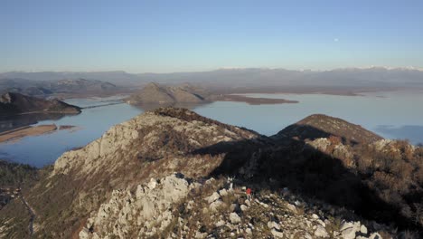 AERIAL---The-mountains-around-Lake-Skadar,-Montenegro,-reverse-rising-shot