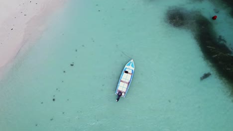 boat-parked-from-above-in-Seychelles-in-4k