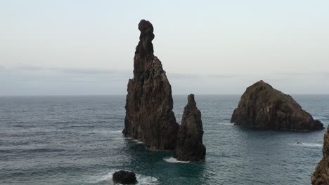 Sharp-Rock-Formation-in-Atlantic-Sea,-Coastline-of-Madeira-Island,-Portugal,-Drone-Shot