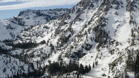 Aerial-of-heavy-snowfall-on-the-mountains-surrounding-Emerald-Bay-Lake-Tahoe
