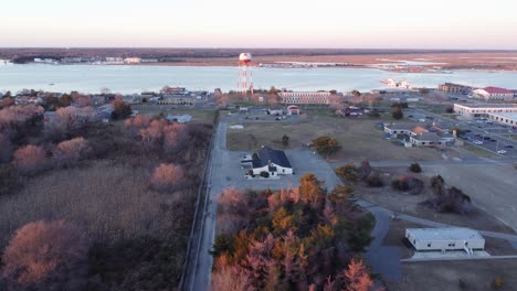 A-beautiful-aerial-drone-shot,-flying-towards-a-water-tower-in-Cape-May-New-Jersey,-Cape-May-County