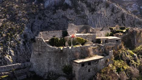 AERIAL---City-walls-and-fortress,-Kotor,-Montenegro,-UNESCO-World-Heritage-Site