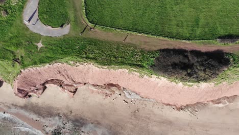 Aerial-Birds-Eye-View-Along-Orcombe-Point-And-Cliffs-Coastline-In-Exmouth