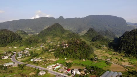 Slow-moving-Aerial-dolly-over-a-small-settlement-at-Ha-Giang,-Vietnam