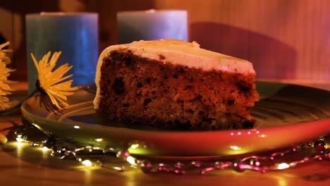 Slice-Of-Deilcious-Carrot-Cake-On-A-Plate-With-Light-Decoration