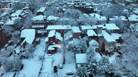 Rear-backyard-view-of-city-homes-covered-in-winter-snow