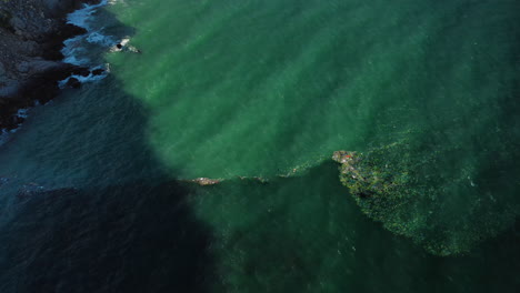 Aerial-birdseye-static-shot-of-garbage-between-two-sea-currents,-Vietnam