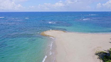 Stunning-sandy-beach-looking-out-at-azure-blue-Caribbean-ocean