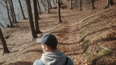 young-man-walking-in-forest