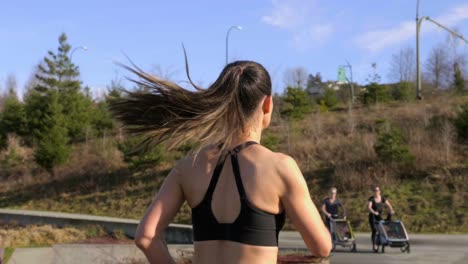 Young-woman-out-running-achieving-fitness-goals-Gimbal-tracking-shot