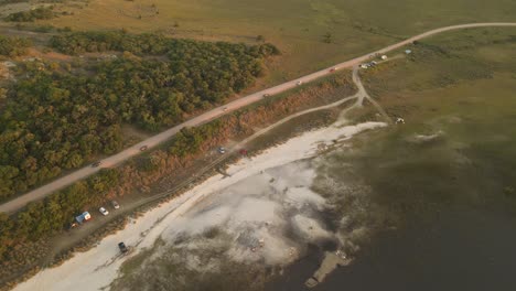 Aerial-top-down-shot-of-cars-with-tourist-parking-at-Laguna-Negra-in-Uruguay---Famous-spot-in-Rocha-Department