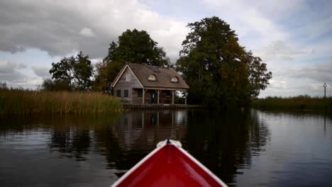 POV-from-a-small-boat-going-towards-the-shore-on-a-lake-in-the-Netherlands