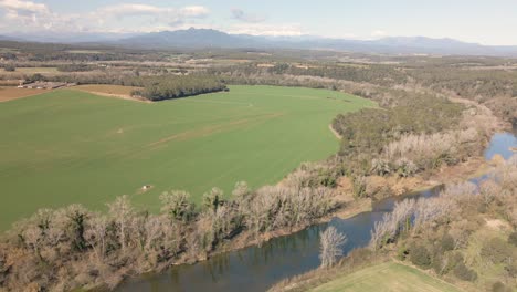 el-fluvia-river-Calm-waters-crop-field-on-the-side-in-winter-Catalonia-province-of-Gerona-Costa-Brava