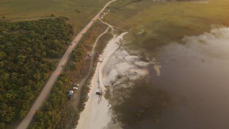 Vehicles-parked-along-road-close-to-Laguna-Negra-or-Black-Lagoon-in-Uruguay