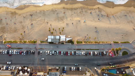 Aerial:-from-buildings-of-a-beach-shore-to-ocean
