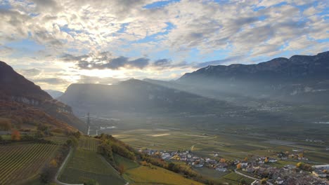 Aerial-Drone-Over-the-Vineyards-over-a-massive-valley-in-Autumn-in-South-Tyrol