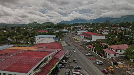 Volcán-Panama-Aerial-v4-low-level-drone-fly-along-country-road-capturing-small-rural-town-located-on-the-highland,-landscape-view-of-houses-surrounded-mountains---Shot-with-Mavic-3-Cine---April-2022