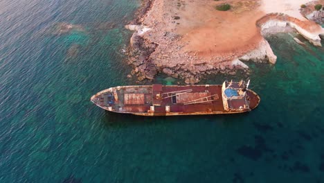 Top-down-of-the-Edro-III-Shipwreck-during-golden-hour,-Cyprus-coast