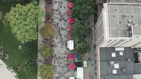 People-attending-Taste-of-Madison-food-festival-in-Madison,-Wisconsin-with-drone-overhead-view