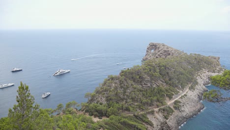 Many-yacht´s-anchor-at-a-rocky-cliff-bay-on-Mallorca-Island
