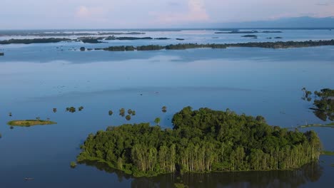 Aerial-view-of-forest-island-submerged-in-flood-water-in-Sylhet,-Bangladesh