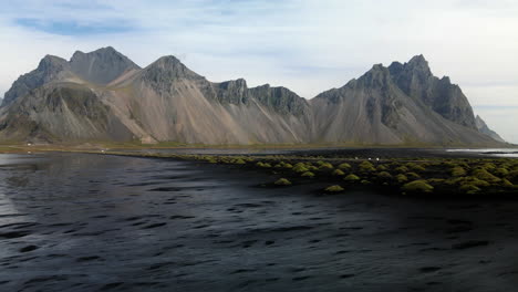 Aerial-shot-approaching-towards-the-mountains-in-the-Stokksnes-peninsula,-in-Iceland