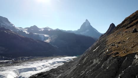 Aerial-view-of-the-Matterhorn-alongside-the-Gorner-glacier-in-Zermatt,-Switzerland-on-a-sunny-summer-day-in-the-Alps