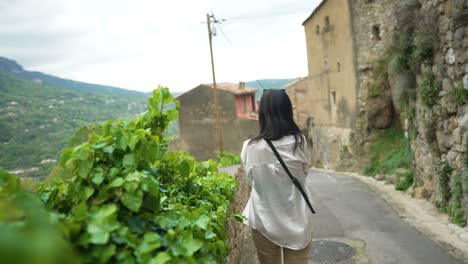 Woman-walking-in-french-village