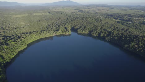 Lake-Eacham-In-Crater-Lakes-National-Park-On-The-Atherton-Tablelands,-Far-North-Queensland,-Australia---aerial-shot