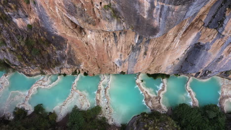Amazing-aerial-shot-with-a-drone-from-the-Andes-area-in-Ayacucho-Peru,-of-the-famous-turquoise-Millpu-lake-located-between-mountains-in-the-afternoon