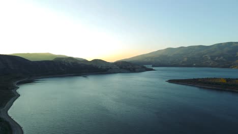 slow-pan-up-Vail-Lake-at-sunset-over-the-mountain