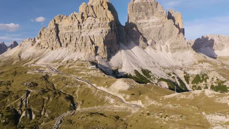 Cinematic-Aerial-View-of-Tre-Cime-Mountains-on-Beautiful-Day