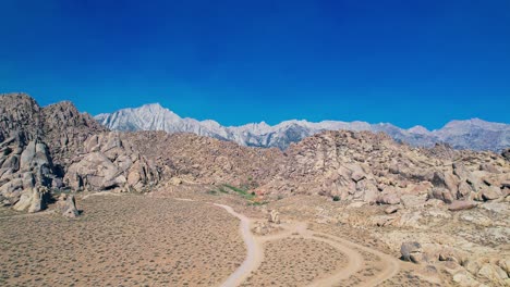Alabama-Hills-in-Lone-Pine-California-4k-Drone-Footage-Push-Forward-Over-Rock-Features-with-Mount-Whitney-in-the-Background