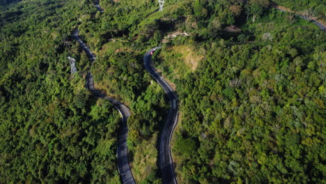 Traffic-on-winding-mountain-road-near-Da-Lat,-Vietnam,-aerial-view
