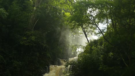 Waterfall-in-the-jungle-with-sunbeams-in-the-mist