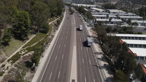 two-trucks-driving-down-oceanside-Boulevard-aerial-view