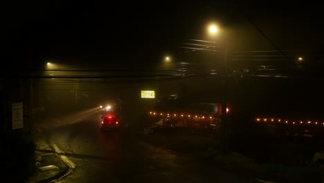 Cars-driving-on-a-misty-road-at-night