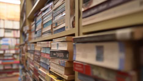 Tracking-shot-of-variety-of-book-stacks-in-a-library,-close-up