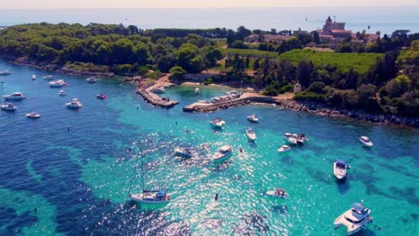Flying-around-the-port-of-Saint-Honorat-island-part-of-the-Iles-de-Lérins,-next-to-Cannes-in-south-of-France